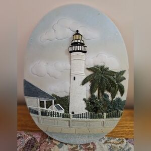 A KEY WEST decorative plaque or piece featuring the Key West Lighthouse